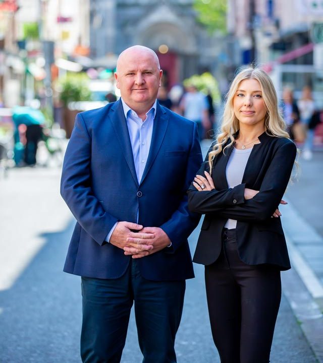 McMahon Goldrick Personal Injury Solicitors​​ Ralph and Grace Standing Outside